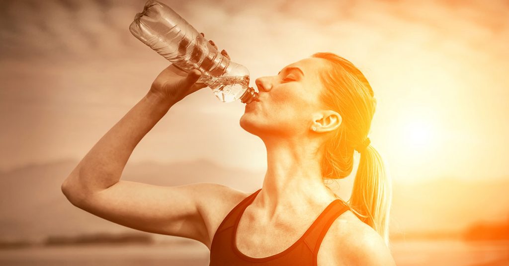 woman-drinking-water-on-hot-sunny-day